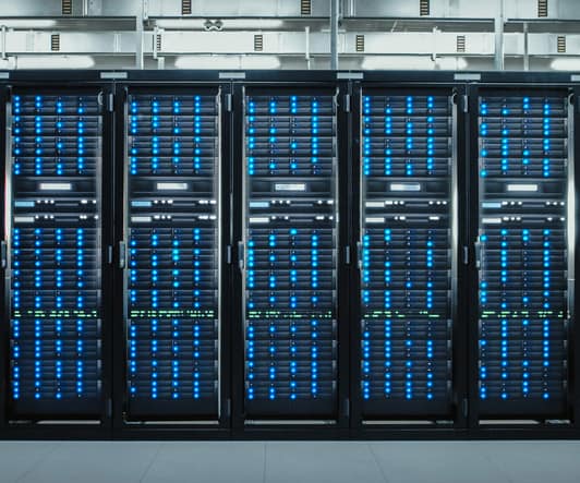 Camera Slide-Trough Shot of a Working Data Center With Rows of Rack Servers. Led Lights Blinking and Computers are Working.